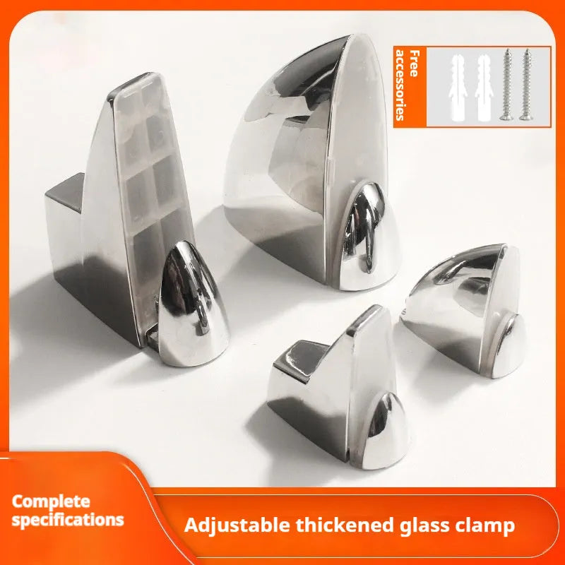 Set of silver electroplated adjustable partition clips in fish mouth and olecranon styles on a glass surface.