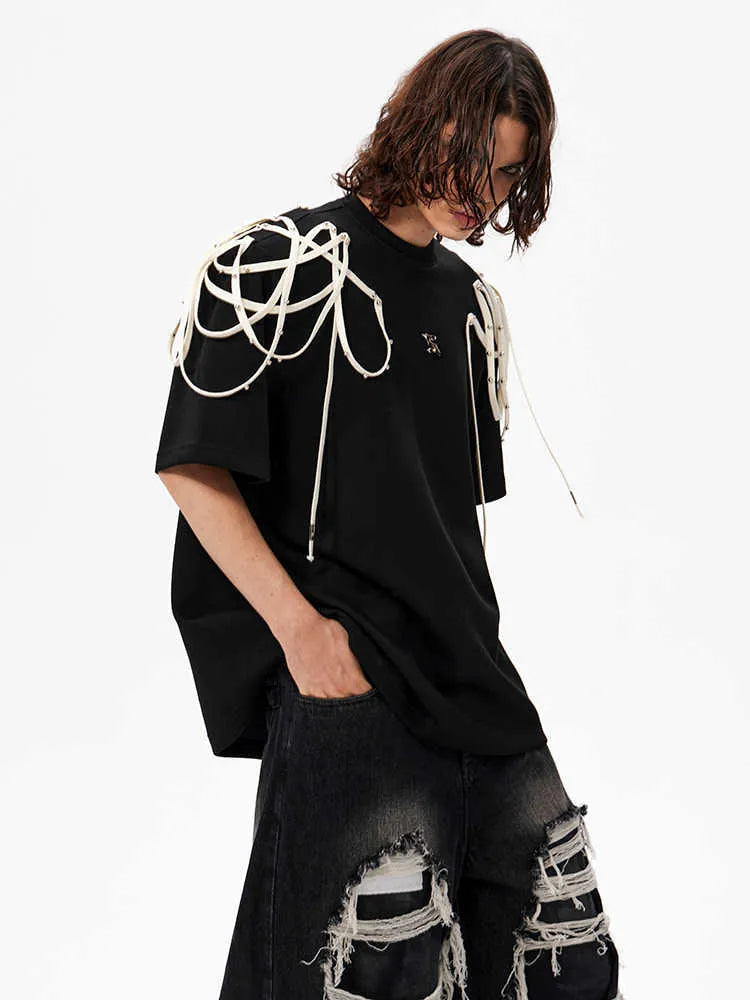 Black loose fit t-shirt with rivet ribbon detail on padded shoulders
