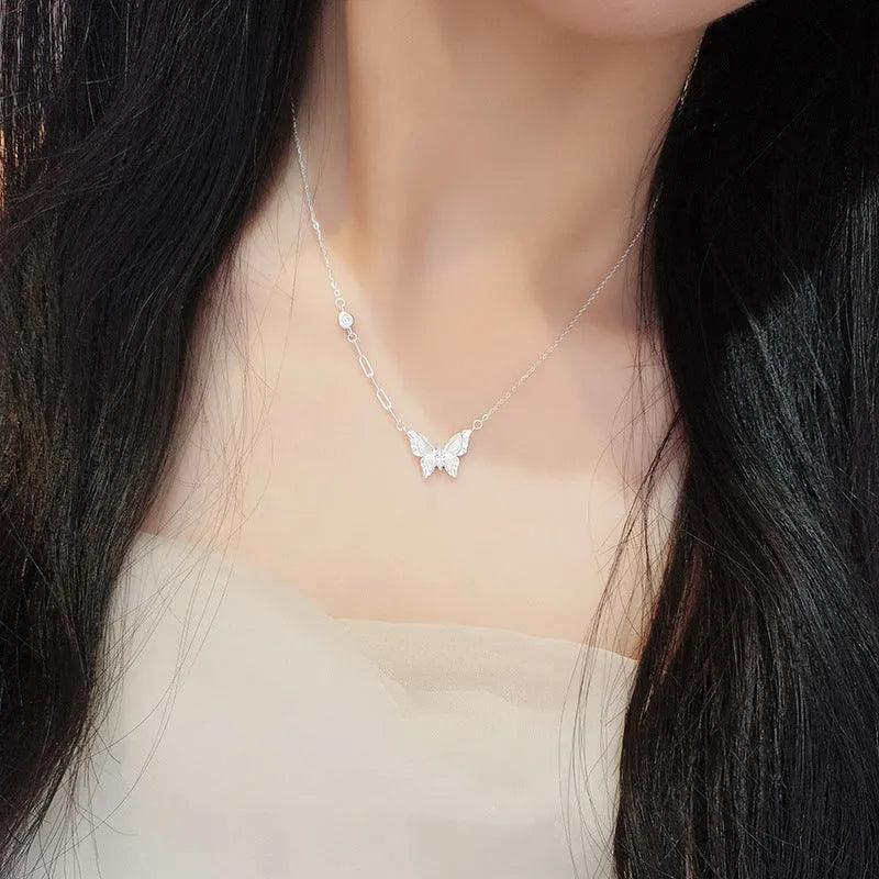 S925 sterling silver brushed butterfly necklace with asymmetric diamond detail on O-ring chain, yellow gold colour