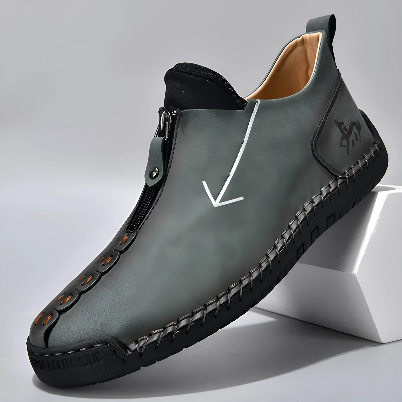 Men's brown zip-up Martin boots with round toe and hand-stitched rubber sole on a neutral background.