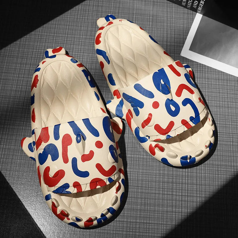 Pair of grey EVA open-toe slippers featuring a large raised shark design on the upper.