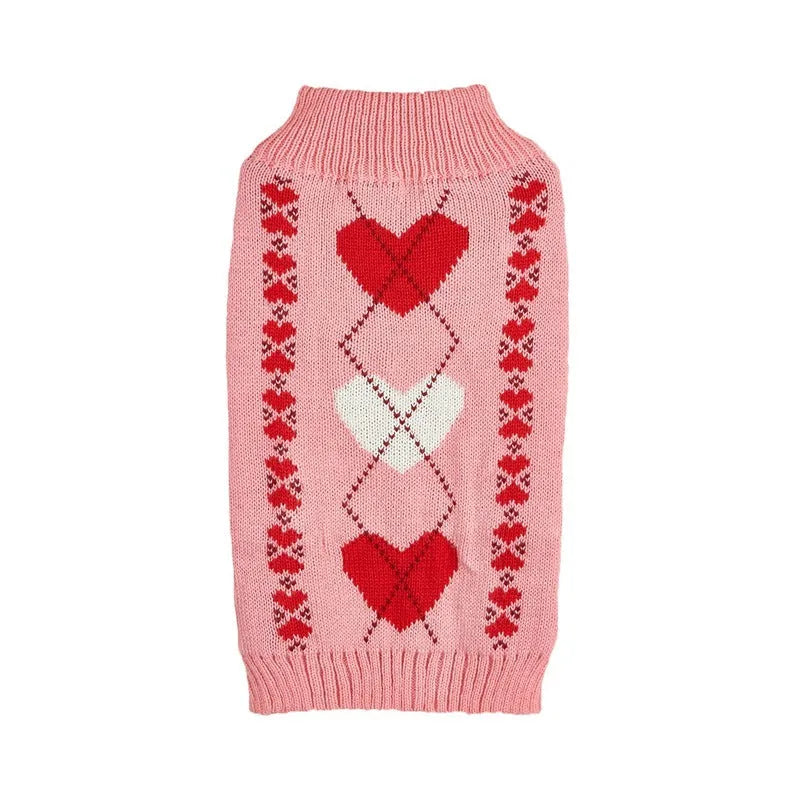 Red dog jumper with a white love heart and bow design on a small dog.