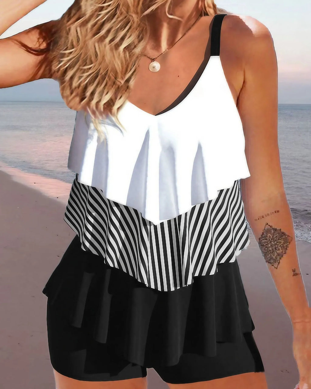 Women's backless bikini swimsuit with spaghetti straps and ruffle detailing in various colour patterns