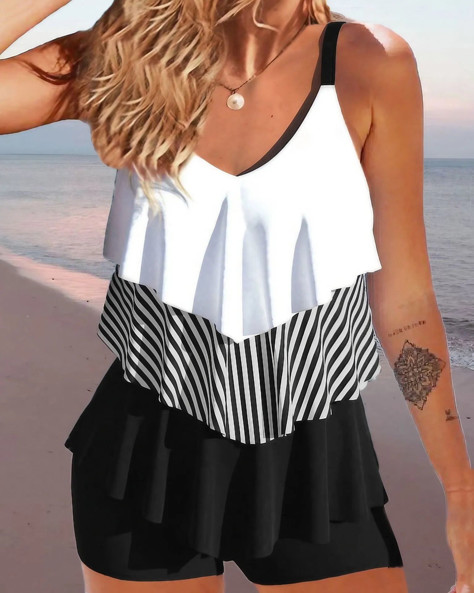 Women's backless bikini swimsuit with spaghetti straps and ruffle detailing in various colour patterns