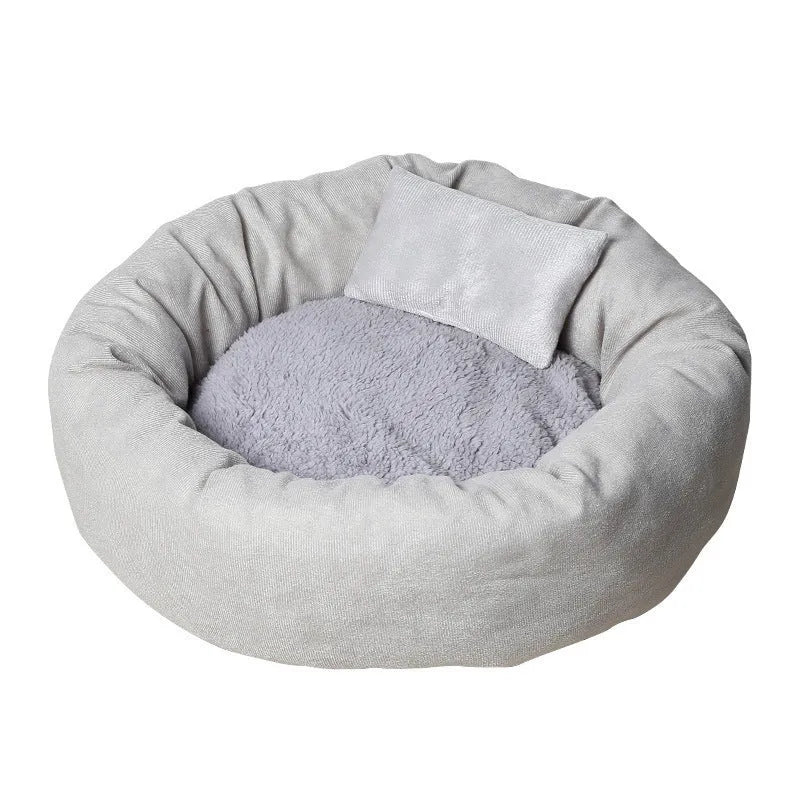 Circular light grey dog bed with PP cotton filling showing raised edges and optional pillow