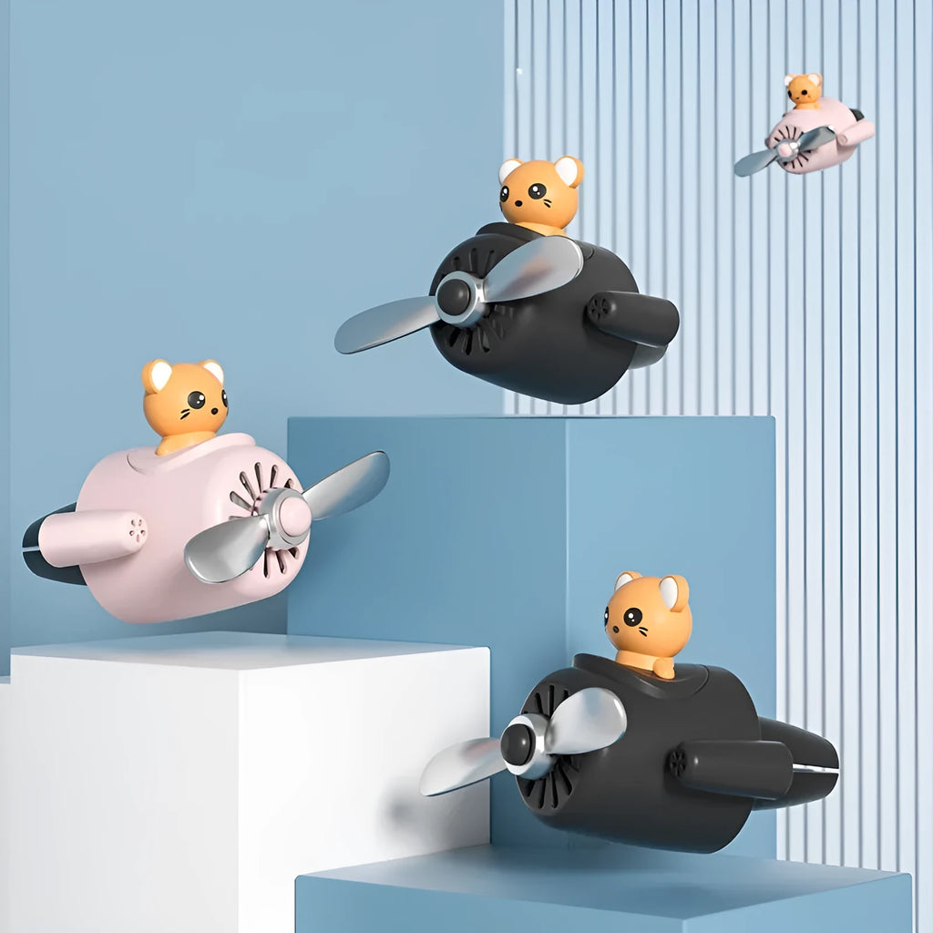 Cartoon airplane-shaped plastic car air vent clip with aromatherapy function in four colours.