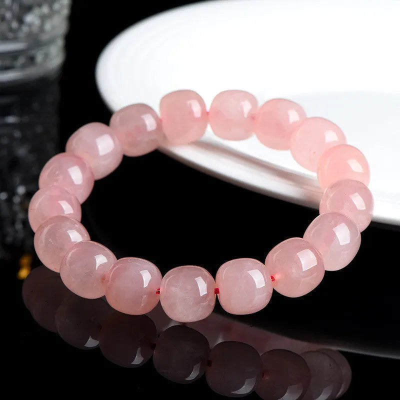 Pink crystal barrel bead bracelet with 8-10mm polished geometric beads
