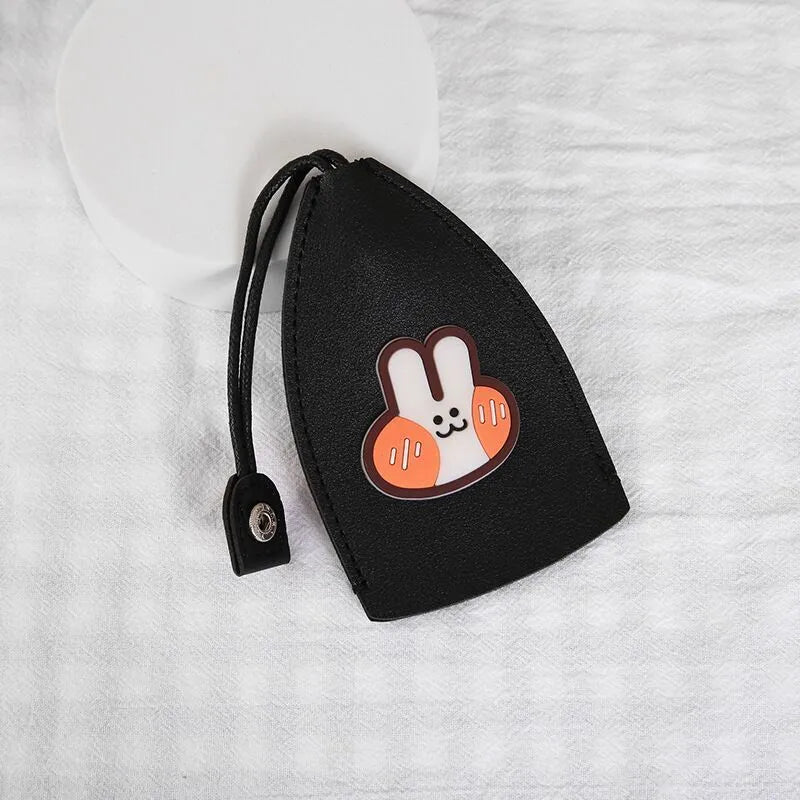 Cartoon pull-out key case in PU leather measuring 14 x 7.5 cm with colourful designs