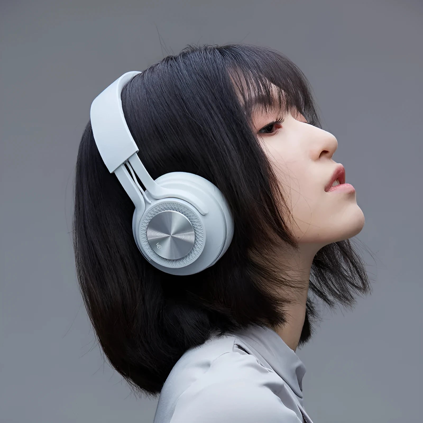 Wireless Bluetooth sports headset in red, grey, green, or black colours.