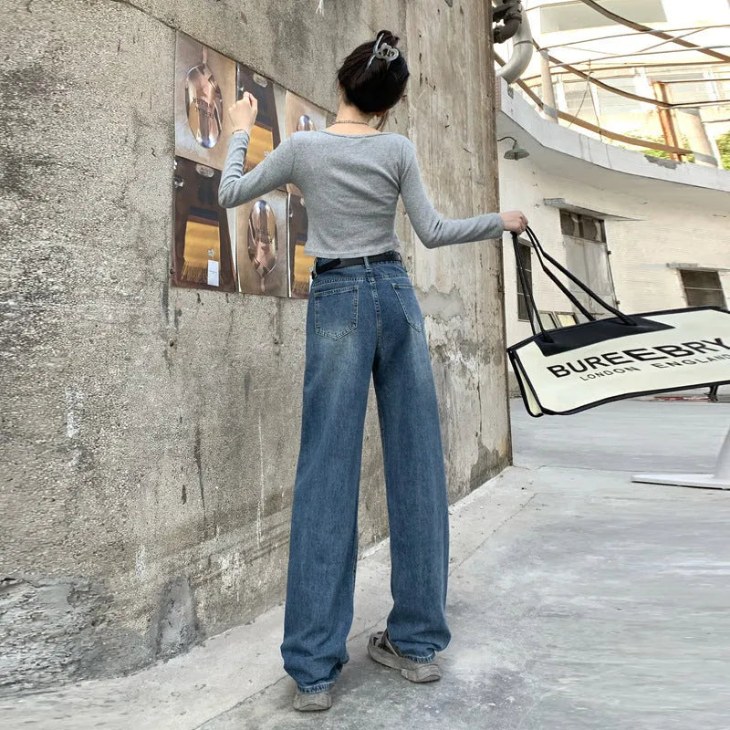 Women's retro blue high waist straight leg jeans on a hanger, showing the classic denim cut.