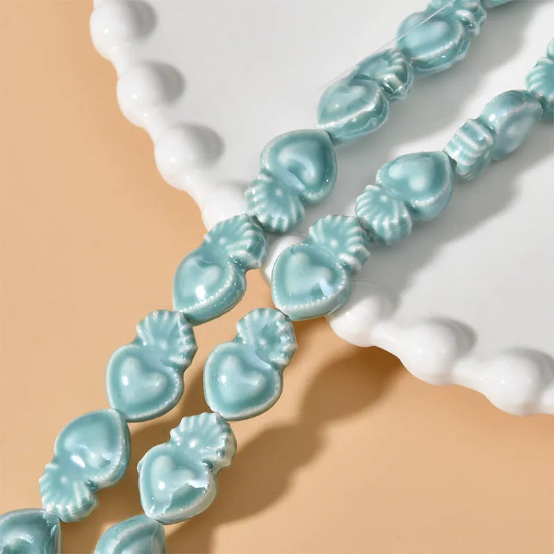 Ceramic love heart small torch shaped beads in various colours with straight holes for jewellery making