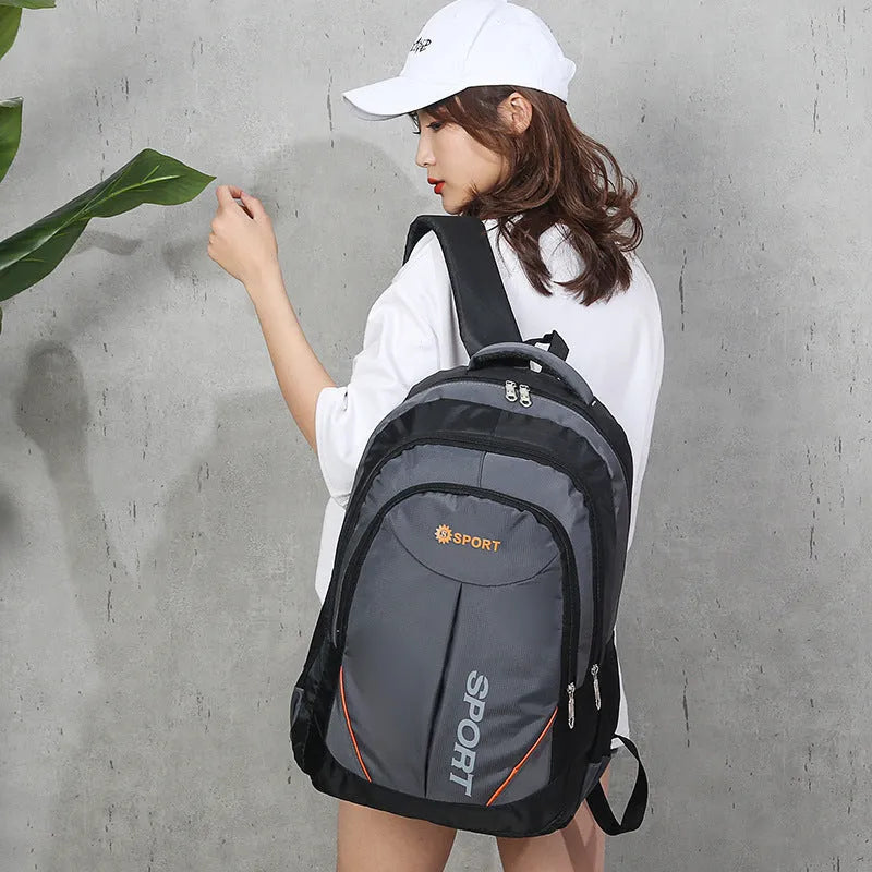 Large black nylon backpack with curved shoulder straps, shown open to display its polyester lining.