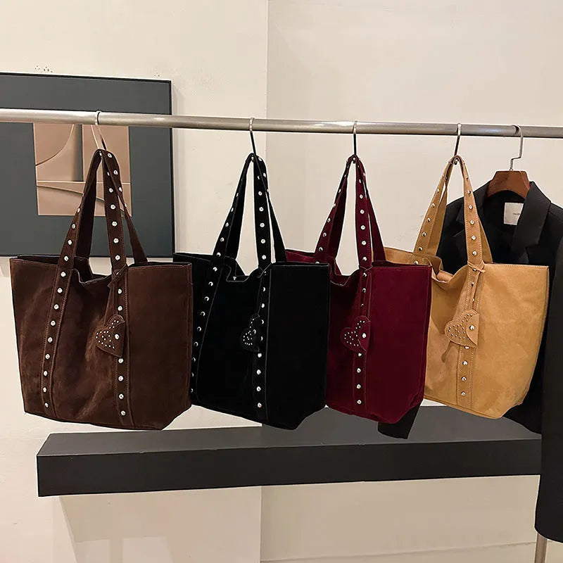 Women's black PU leather tote bag with double shoulder straps showing sandwich pocket detail