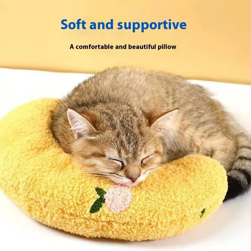 Blue U-shaped cat pillow in a question mark style on a white background