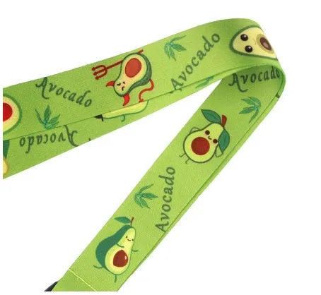 Polyester lanyard with double-sided avocado cartoon print and plastic buckle, shown at full 45cm length.