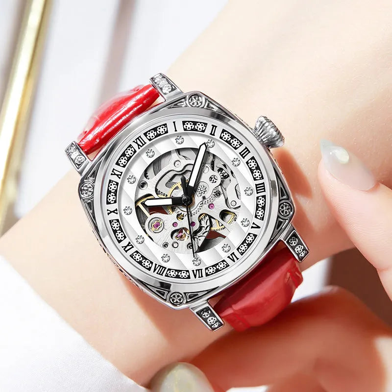 Men's mechanical watch with luminous hands and a black leather strap showing analogue dial.