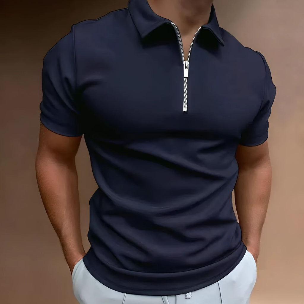 Man wearing a navy blue digital print polo shirt with short sleeves and a loose fit.