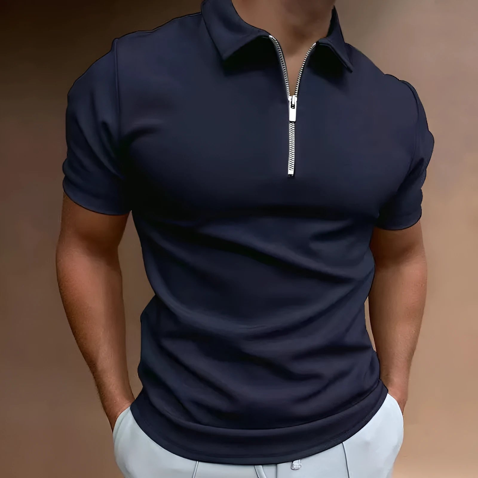 Man wearing a navy blue digital print polo shirt with short sleeves and a loose fit.