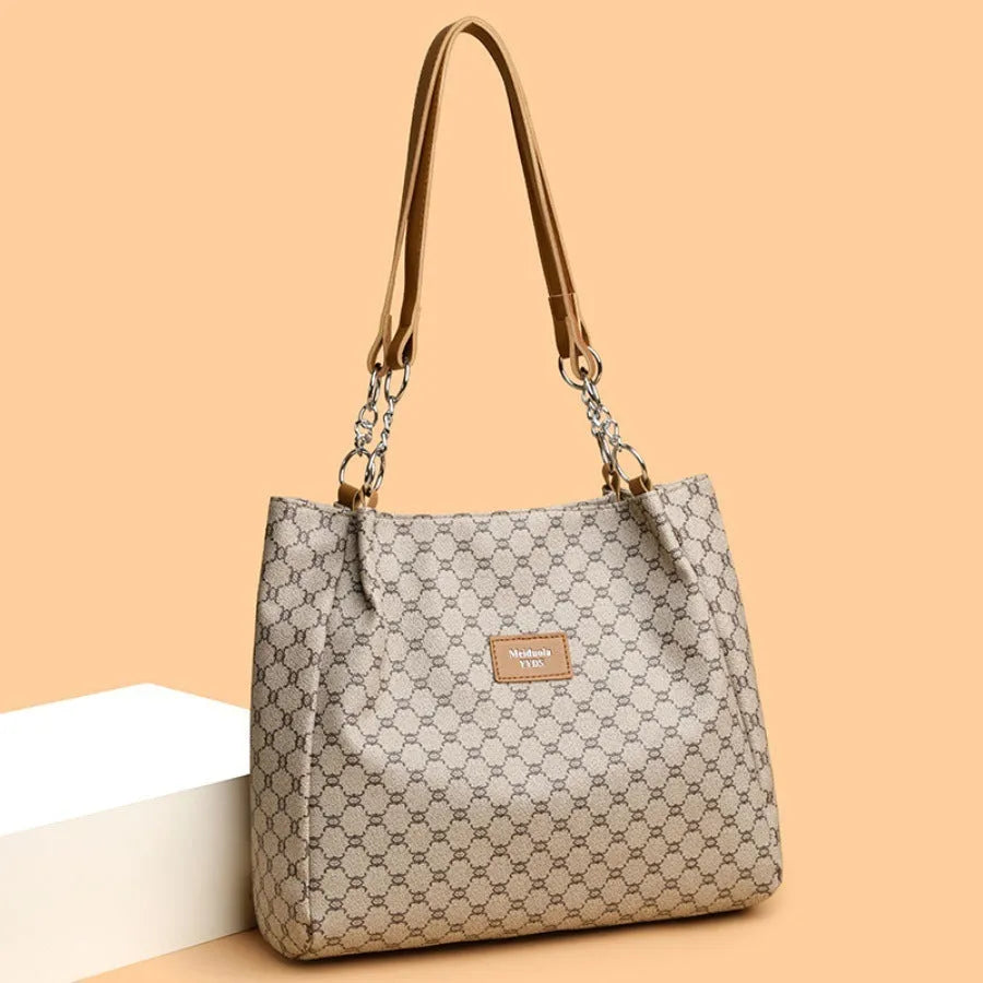 Women's retro fashion handbag in soft brown PU leather with polyester lining.