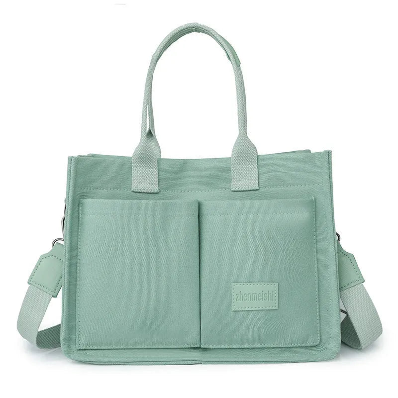 Large casual canvas tote shoulder bag for women with multiple pockets in creamy white