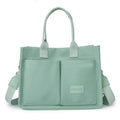Large casual canvas tote shoulder bag for women with multiple pockets in creamy white