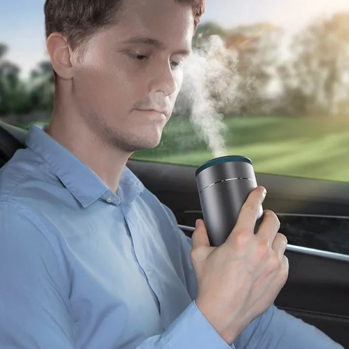 Dark gray column-shaped mini USB aromatherapy humidifier with 0.5-1L tank and single fog export.