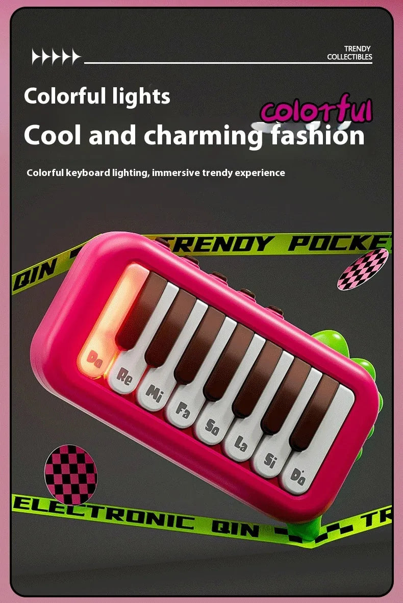 Pocket electronic keyboard toy for children in green or pink, plays little piano patterns for developmental training.