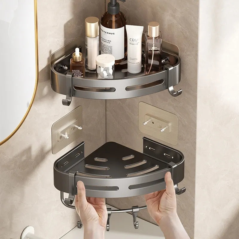 Gun grey punch-free bathroom corner storage rack with triangle basket mounted on wall.