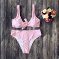 Women's two-piece bikini set in solid colour with bra top and matching panties