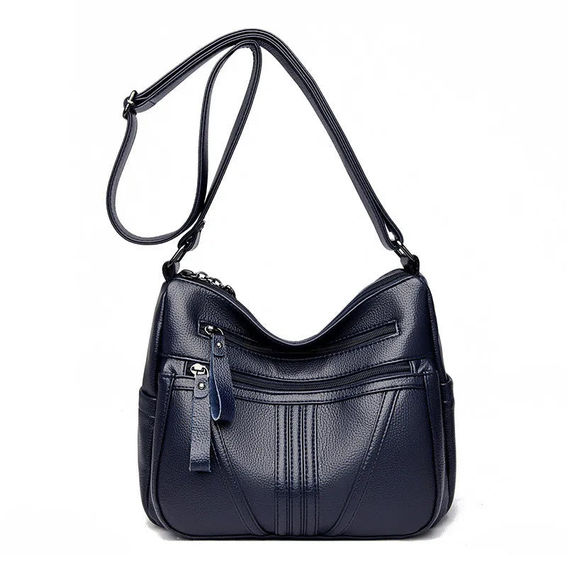 Genuine leather shoulder messenger bag in horizontal square shape with multiple internal compartments and single strap