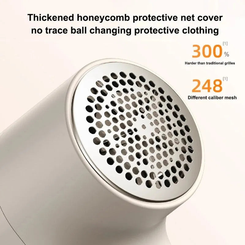 White electric lint remover with LED display showing fabric shaver dimensions