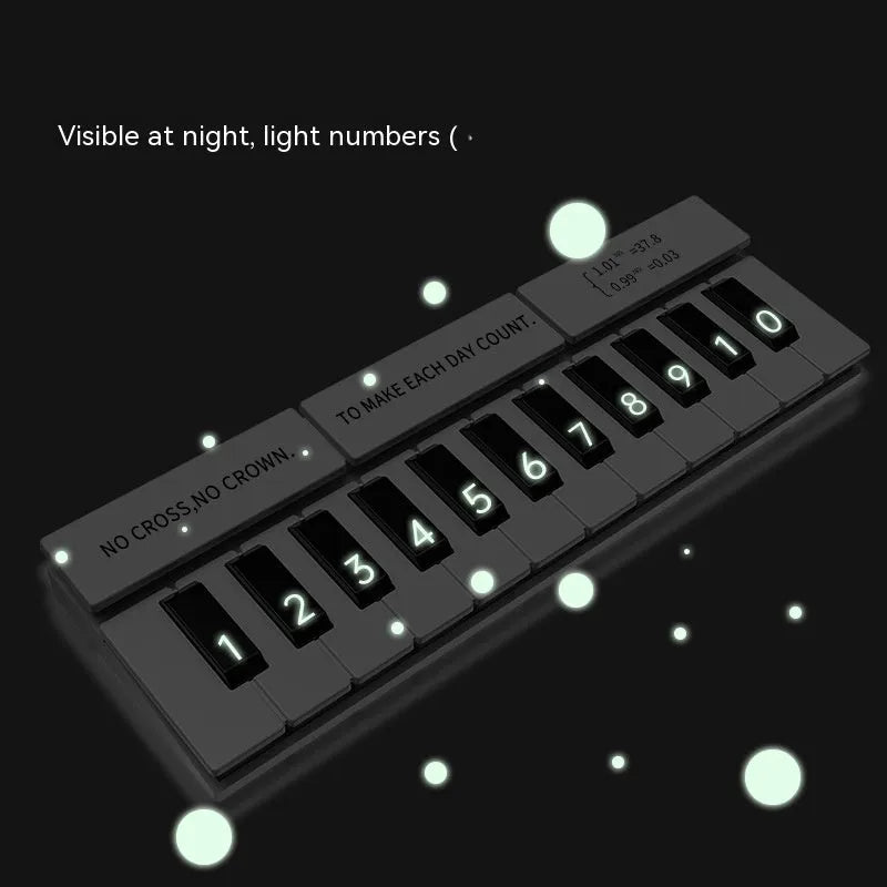 Black and white piano-shaped plastic temporary parking sign for vehicle dashboard