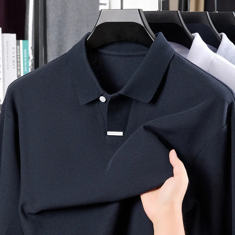 Men's grey loose-fit cotton polo shirt with an asymmetric lapel collar and long sleeves.