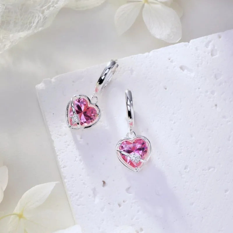 S925 sterling silver heart shaped earrings for women in pink electroplated finish on white background