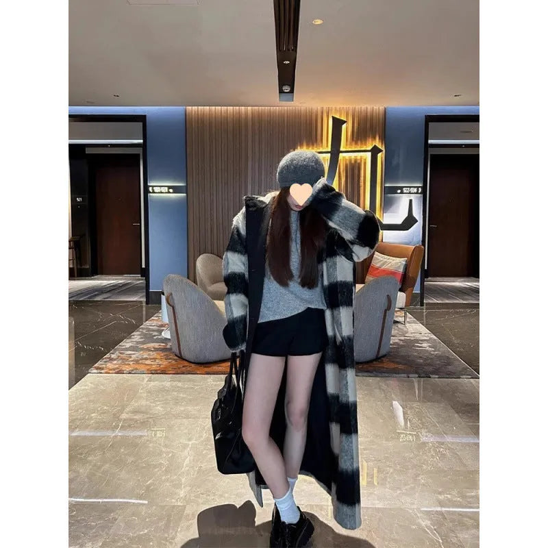 Beige and black plaid mid-length loose fit polyester women's winter woolen coat with lapel collar on a model