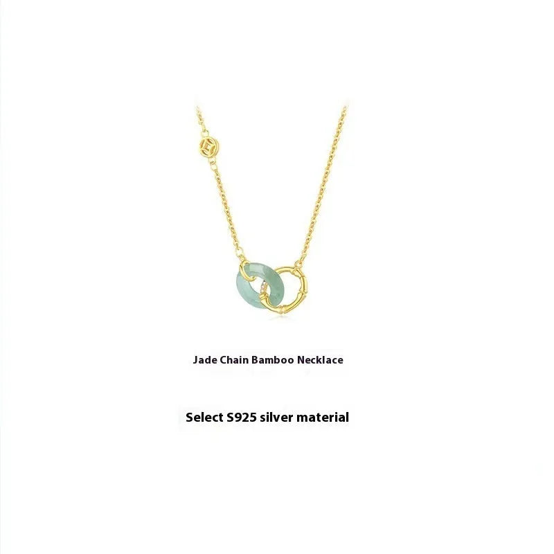 Sterling silver bamboo joint peace buckle necklace on an adjustable O-ring chain with a geometric pearl detail.