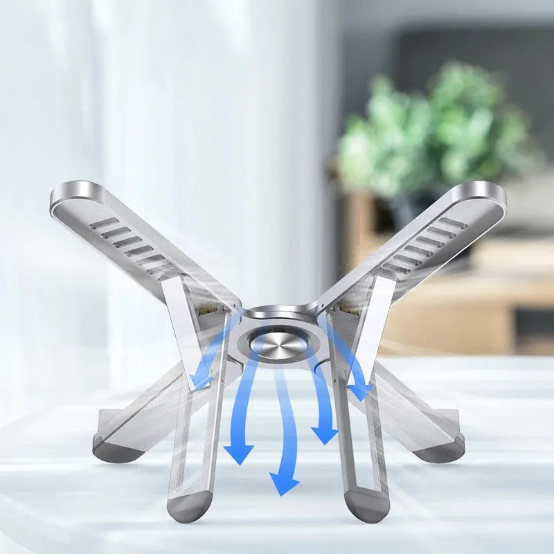 Foldable aluminium alloy laptop bracket in silver raised on a desk surface
