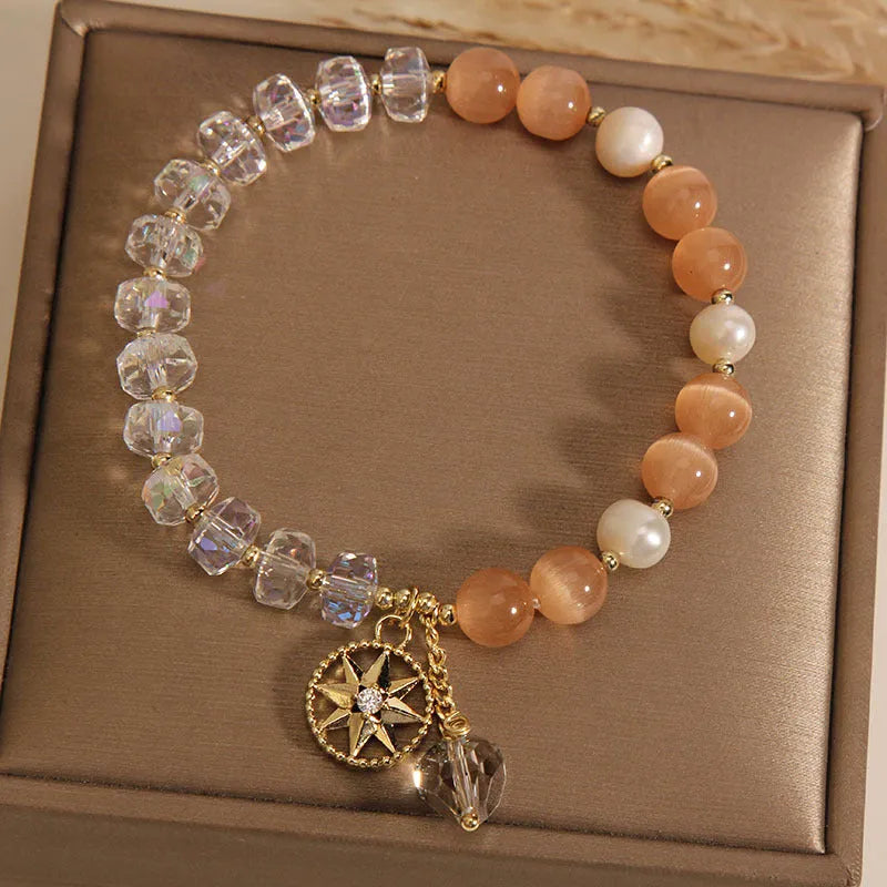 Gold-plated bracelet with eight Awn star motif and orange opal crystals
