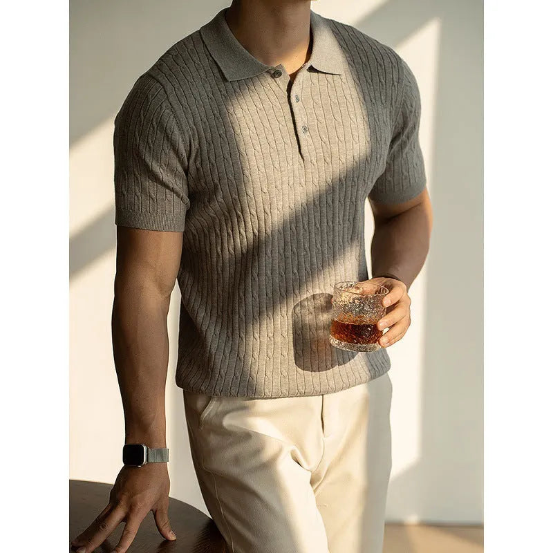 Men's khaki short sleeve business casual top laid flat, showing collar and button placket detail.