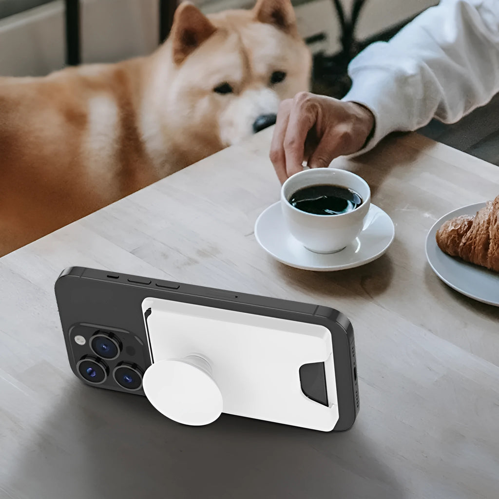 Minimalist magnetic suction phone holder in five colour options on office desk
