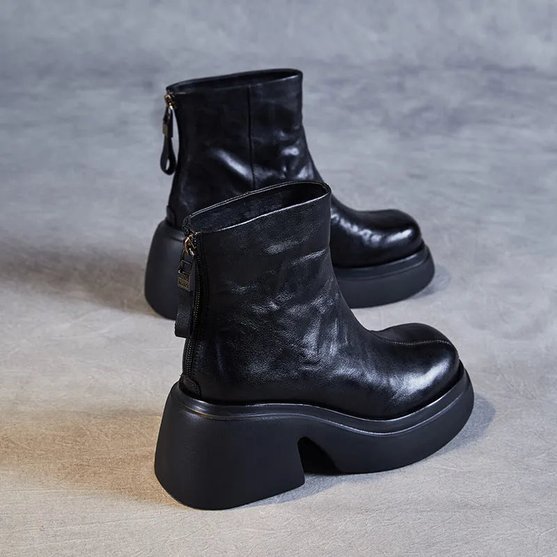 Women's chunky heel ankle boots in black with thick bottom, rubber outsole, and cotton cowhide upper