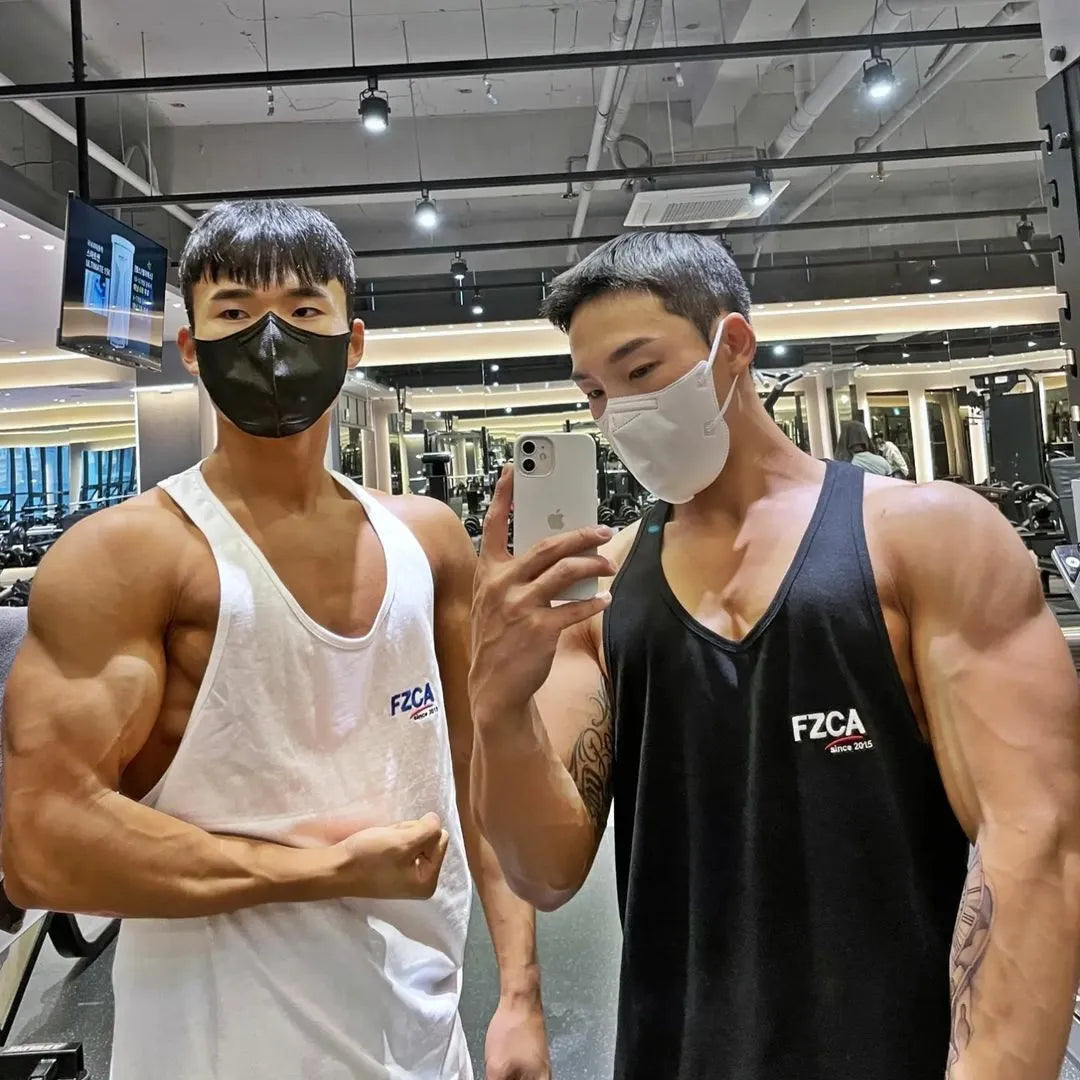 Men's white cotton fitness vest for summer running and gym training on a plain background