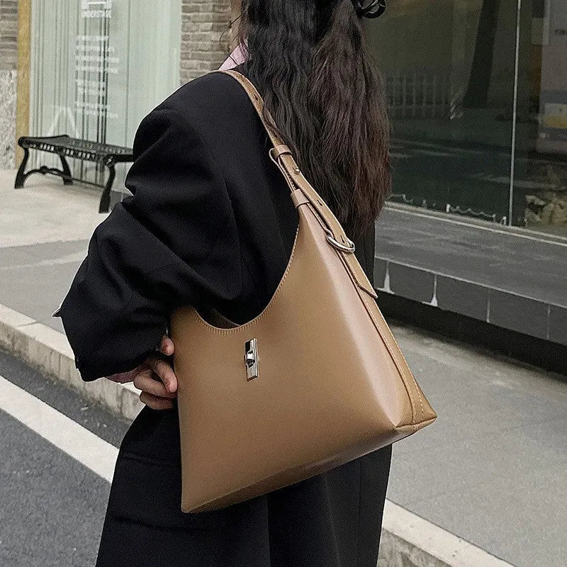 Genuine cowhide leather crossbody shoulder bag in dumpling shape with organised internal compartments