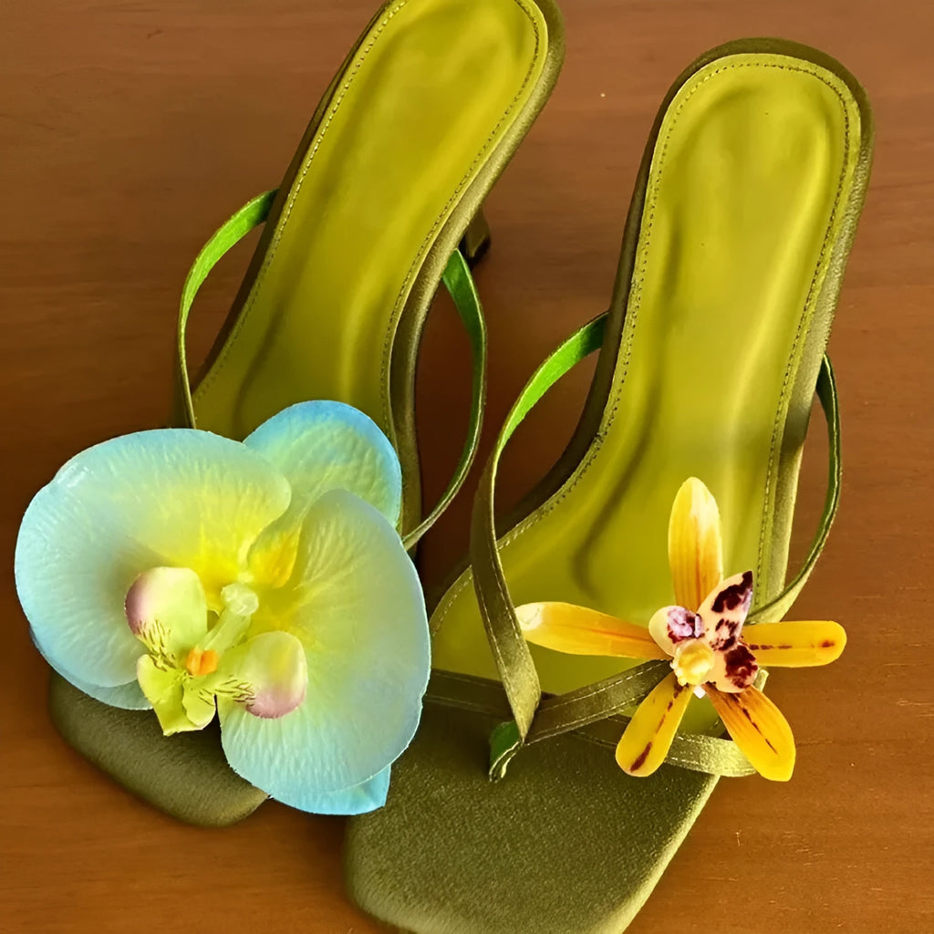 Women's handmade asymmetric flower design sandals with a high heel in calf leather.