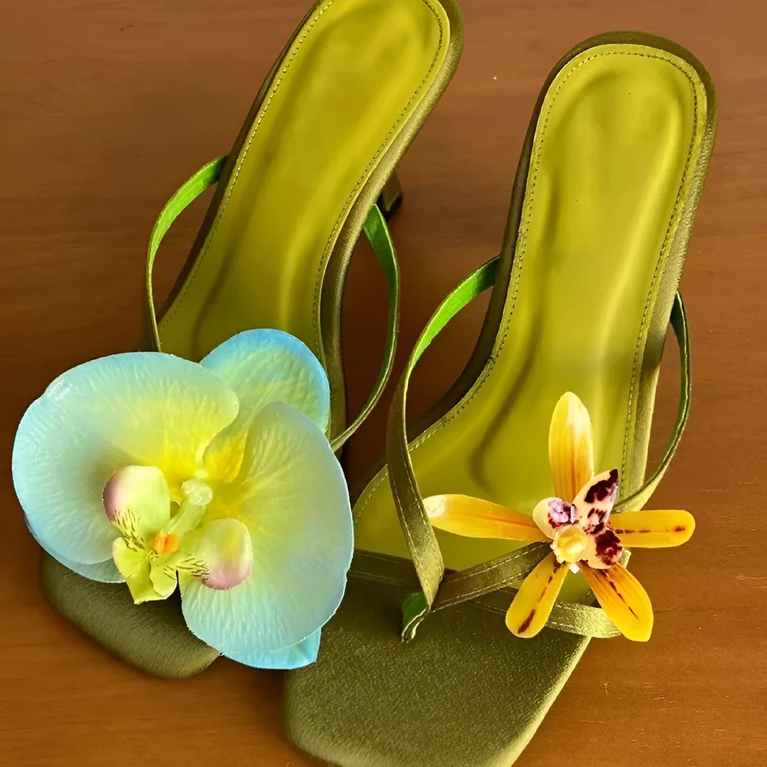 Women's handmade asymmetric flower design sandals with a high heel in calf leather.