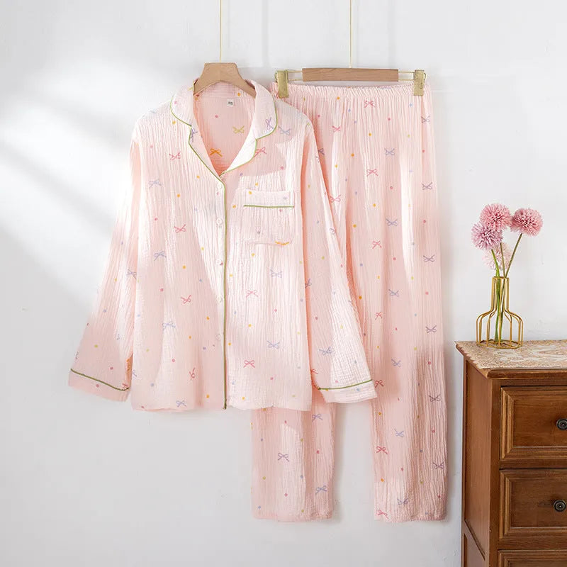 Women's long sleeve cotton pajama set in pink, featuring a crepe cloth top and trousers for homewear.