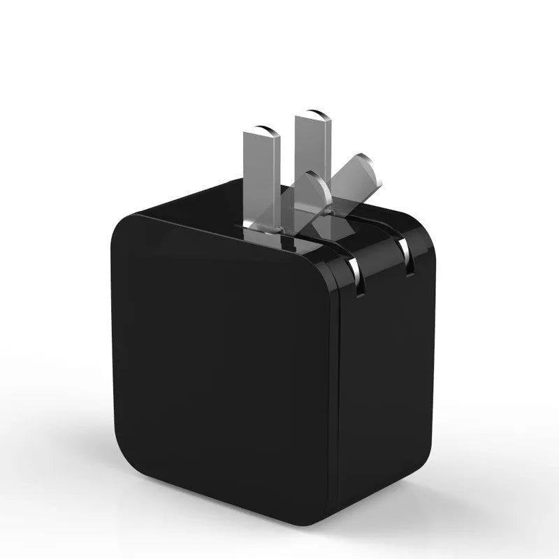 Black 5V 2.4A dual USB travel charger with digital display and a UK plug on a white background.