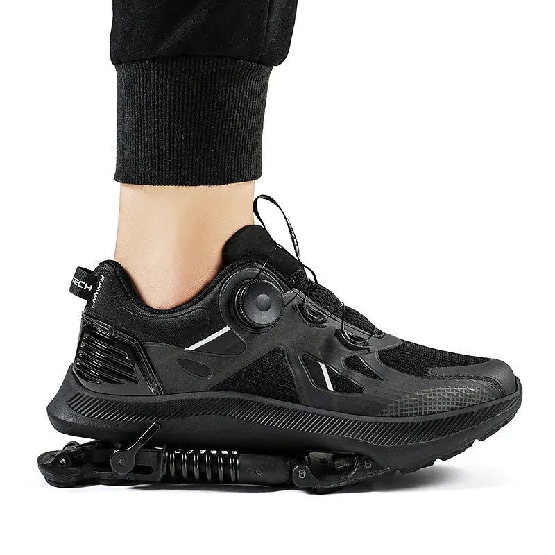 Black Tech running shoes with mesh upper, buckle fastening, and rubber sole on a white background.