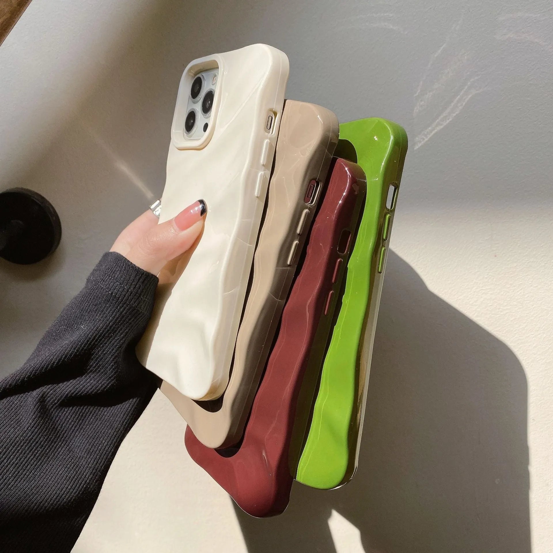 Wave pleated TPU phone case for Apple iPhone 17 in burgundy colour showing textured pattern