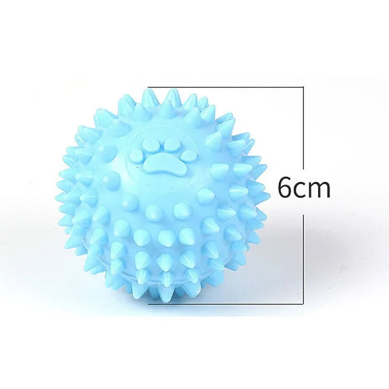 Blue TPR dog chew ball with textured footprint pattern and tooth cleaning nubs